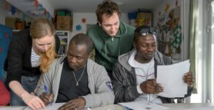 Immigration Interpreter - Two Men Holding Papers