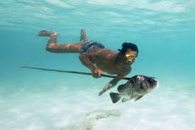 Moken Language - Moken Diver With Fish and Spear