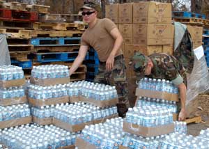 Contronym Examples - Army Men Giving Out Water Bottles