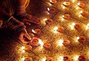Diwali Celebration - Woman Lighting Diyas