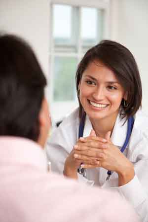 Patient Centric Healthcare - Doctor smiling at patient