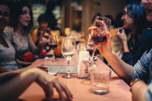 Untranslatable Spanish Words - People speaking at dinner table