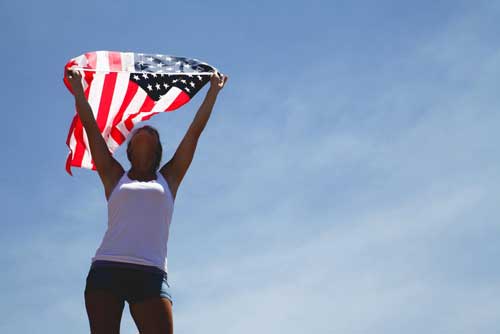 Untranslatable Spanish Words - Young girl holding U.S. flag