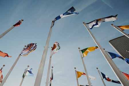 Immigrants and the Economy - Multinational Flags
