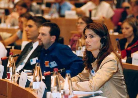 woman with headset at conference