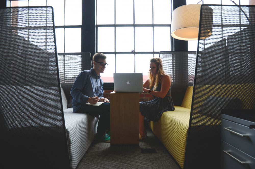 Intellectual Property Translation - Man and Woman Working in Cubical 