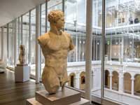 Translation and Localization - Ancient Statue of Man in Museum