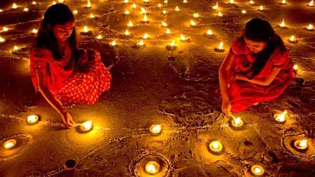 Diwali Celebration - Two Women Lighting Candles