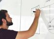 Localization Marketing - Man drawing strategy on whiteboard