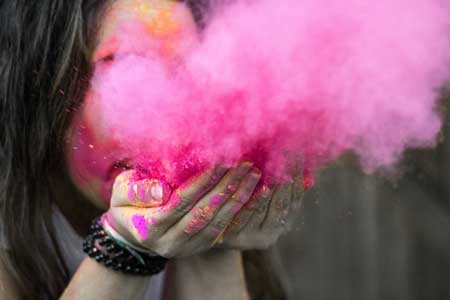 Color Meanings - Girl Blowing Pink Dust