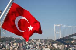 Healthcare Language Services - Turkish flag in front of bridge