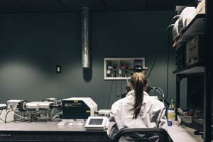 Japanese Interpreter - Woman Researcher using Medical Equipment