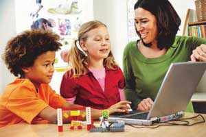 Spanish Interpreters - Teacher with two students and computer